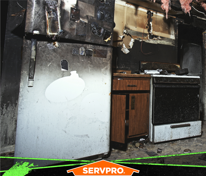 Fire and soot damage in a kitchen.